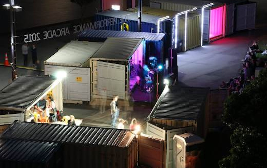 Shipping containers are lit up with lights and art on Wellington's waterfront for the Performance Arcade